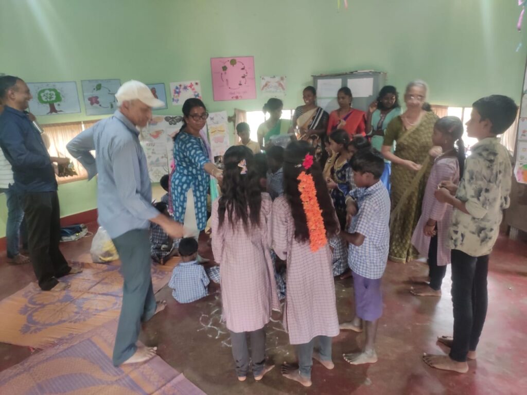 Chitra and KFI Study Centre friends with children